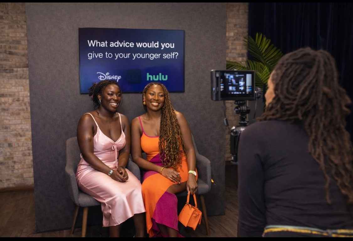 Guests participating in The Social Hub Nola’s interview booth during Disney and Hulu’s Black Stories Always activation.